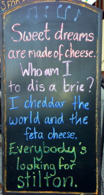 Sign in front of  The Village Cheese Shop.